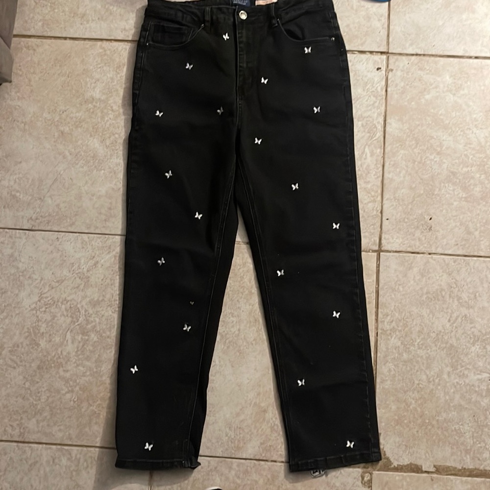 Black mom jeans with white butterfly’s around